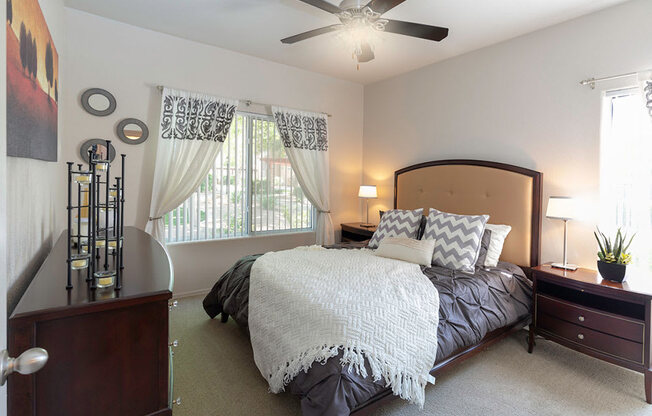 Well Decorated Primary Bedroom With Natural Light at Canyon Ridge Apartments, Arizona