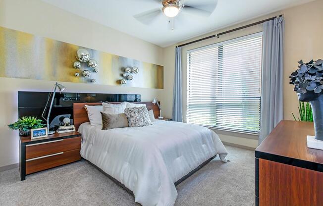 a bedroom with a large bed in a hotel room