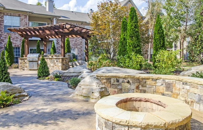 Harpeth River Oaks - Stone Courtyard and Grill Area Surrounded by Lush Landscaping