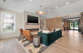 a living room with a couch and a table with chairs