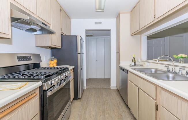 a kitchen with a stove and a sink