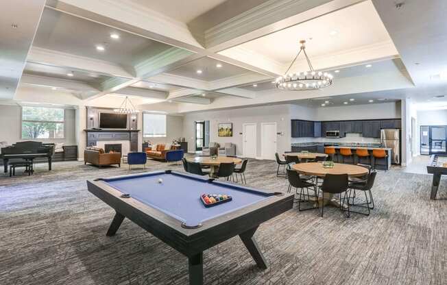 a large gathering room with a pool table and several tables and chairs at The Beckstead, South Jordan, UT