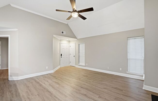 Bright Top-Floor Condo with Vaulted Ceilings & Balcony