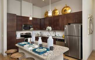 a kitchen with stainless steel appliances and a granite counter top