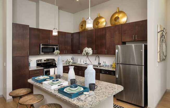 a kitchen with stainless steel appliances and a granite counter top