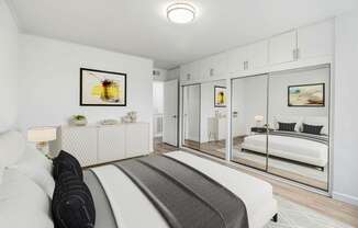 a bedroom with a bed and a mirror