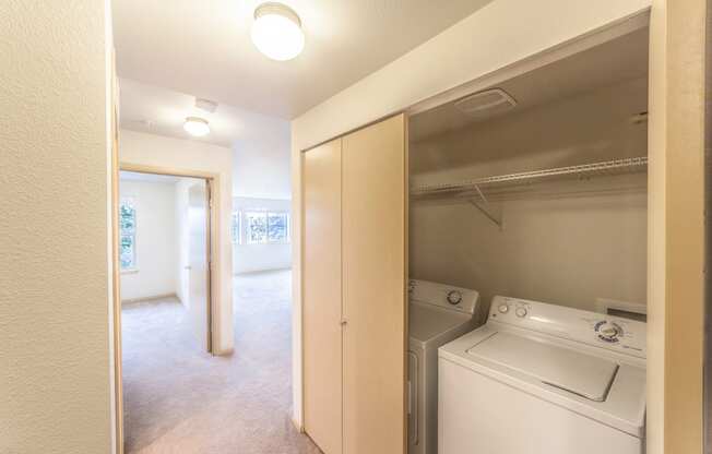 a room with a washer and dryer in it