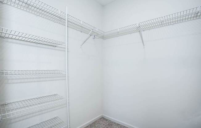 Empty shelves in a white room.