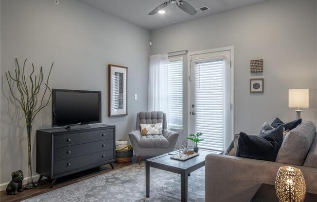 a living room with a couch and a tv