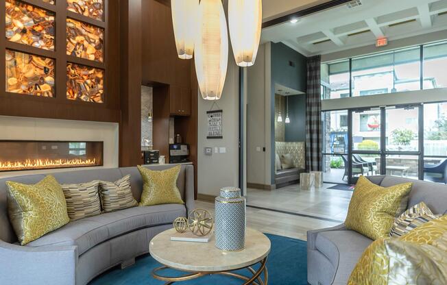 a living room filled with furniture and a large window