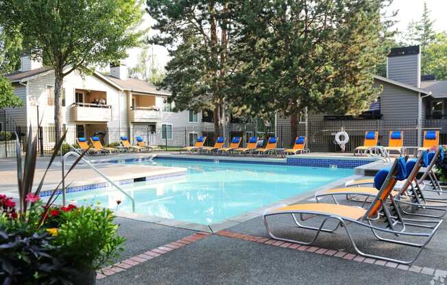 Fulton's Crossing and Landing Apartments resort style pool with lounge chairs