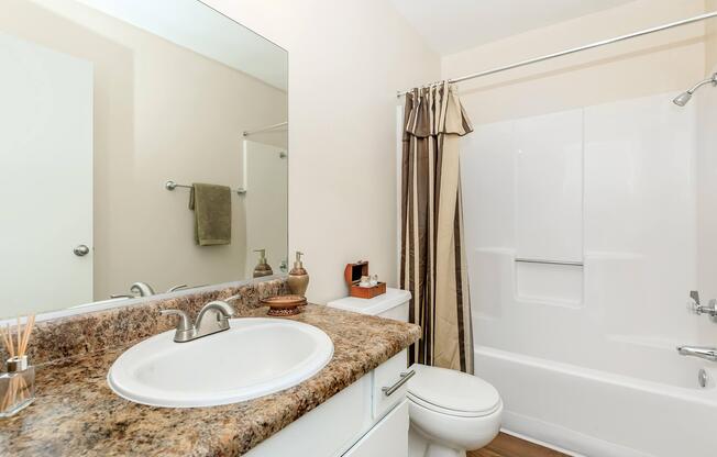 a room with a sink and a mirror