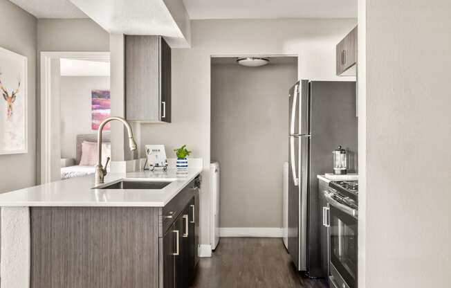 a kitchen in a 555 waverly unit with stainless steel appliances