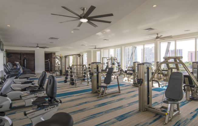 A variety of exercise equipment fills a gym in a Miami apartment building.