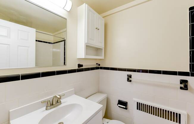 bathroom with sink, mirror medicine cabinet and tile detail at sherry hall in washington dc