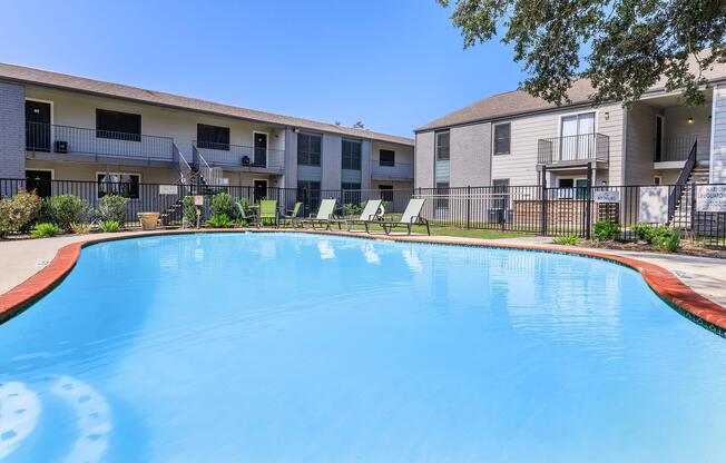 a large pool of water in front of a house