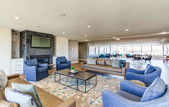 a living room filled with furniture and a large window