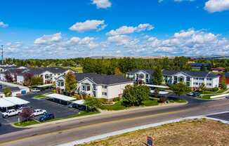 an aerial view of a neighborhood of houses on a city street at Eagles Landing Apartments, Ammon, ID