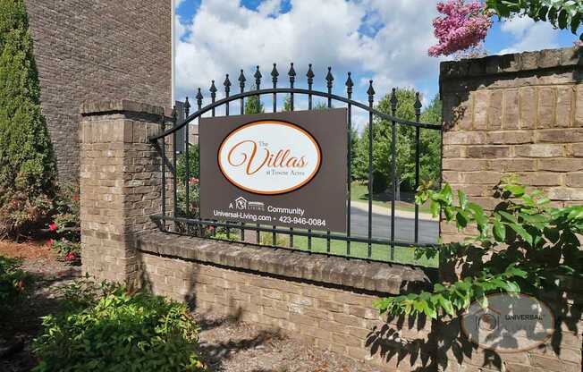 The sign at the property entrance that reads "The Villas at Tonwe Acres."