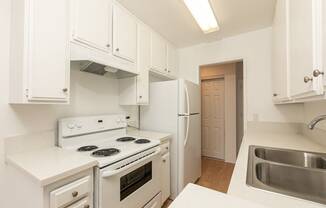 Kitchen with White Appliances and White Cabinets