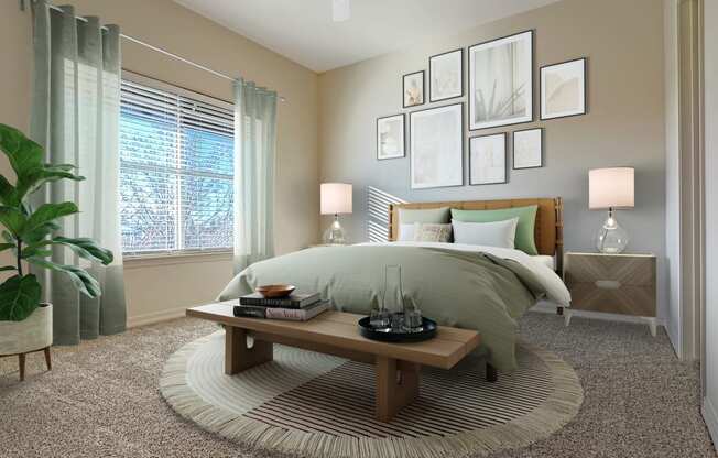 Liberty Bend Apartments, Sandy, Utah, Bedroom with bed, table and artwork on walls.