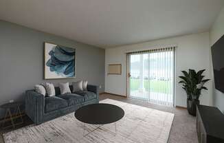 A living room with a couch and a coffee table. Fargo, ND Pinehurst Apartments.