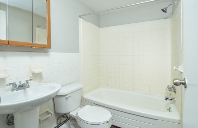 Lovely bathroom with toilet and cozy sink in The Wellington apartment rentals in Hatboro, PA