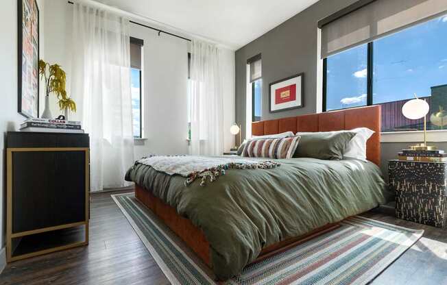 Spacious Bedroom with Plenty of Natural Light and Wood Flooring