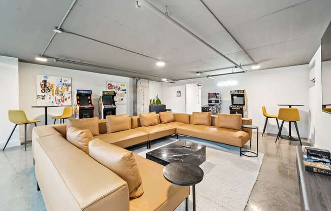 A modern living room with a tan sofa set and a coffee table.