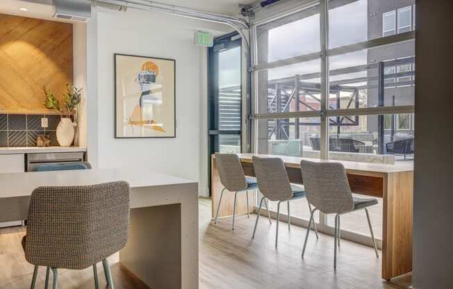 Clubroom with seating area overlooking the outdoor courtyard