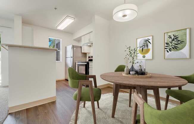 a living room and dining room with a table and chairs