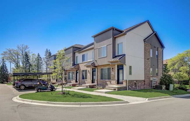 a row of houses with a car parked in front of them