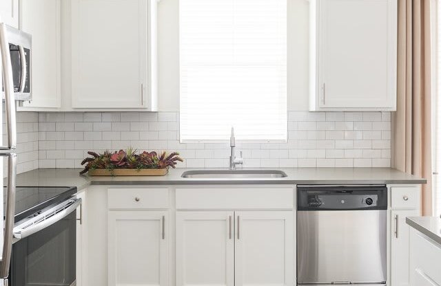 White Cabinetry In Kitchen at Rivulet Apartments, American Fork, UT