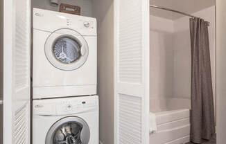 a washer and dryer in a bathroom at The Millennium, Arlington, VA, 22202