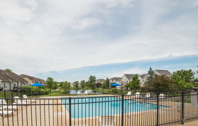 Swimming Pool and pool chair at Cambridge Club Apartments in Ann Arbor, Michigan