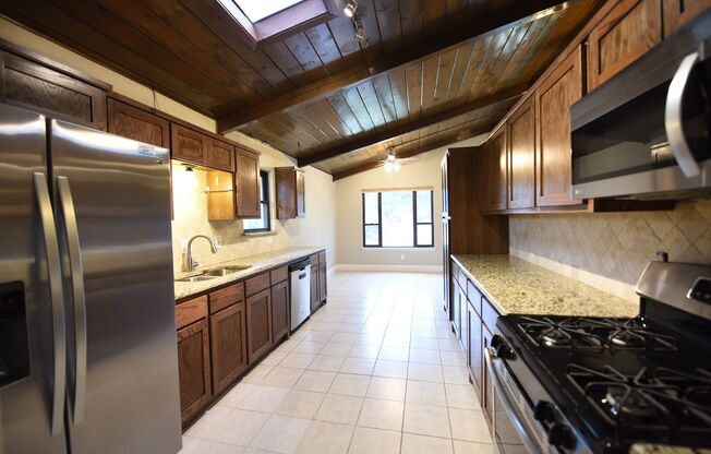 4 Bedrooms With Vaulted Ceilings On a Wooded Lot!