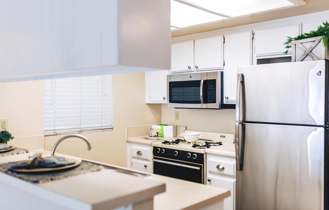 a kitchen with a stove top oven sitting inside of a refrigerator