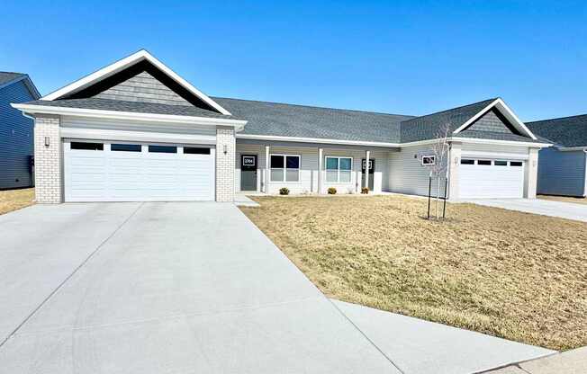 A two-car garage is attached to a house.
