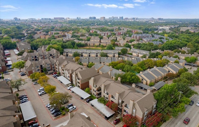 an aerial view of a neighborhood with houses and trees