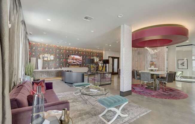 A living room with a red couch and a white coffee table at Infinity on the Point Apartments, Dallas, TX, 75243