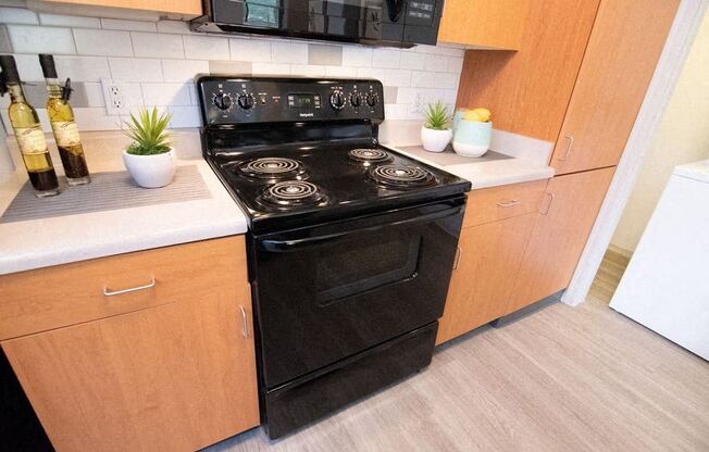 a kitchen with a stove and a microwave