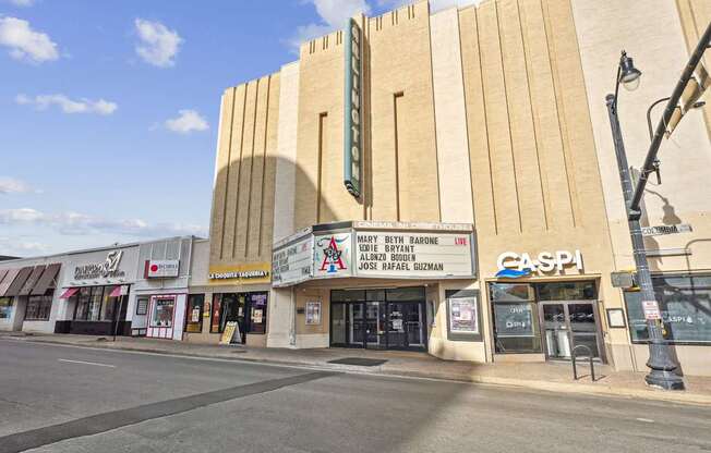 A street view of a building with a sign that reads