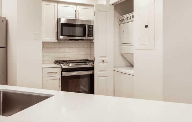 Kitchen with In-home Washer and Dryer