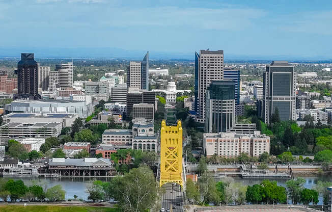 A cityscape with a yellow structure in the foreground.