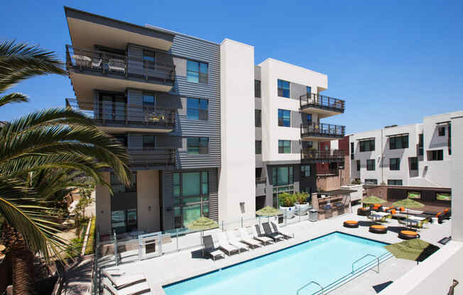 a view of the pool and exterior of building