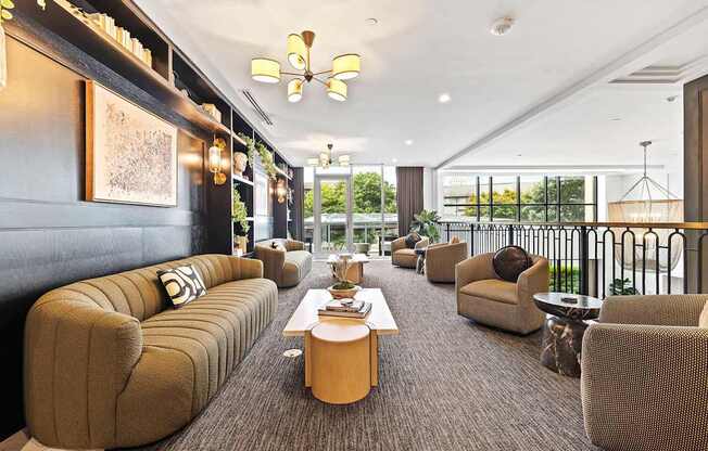 A modern living room with a long sofa and a coffee table.