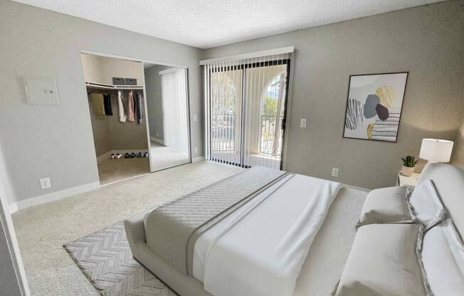 a bedroom with a large bed and a sliding glass door