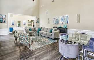 a living room with couches and chairs