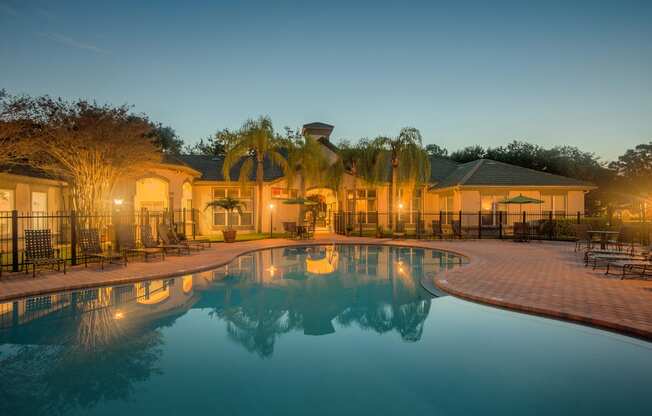 Versant Place Apartments resort-style pool at dusk
