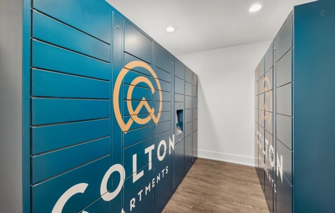 Colton apartments logo on a blue wall.